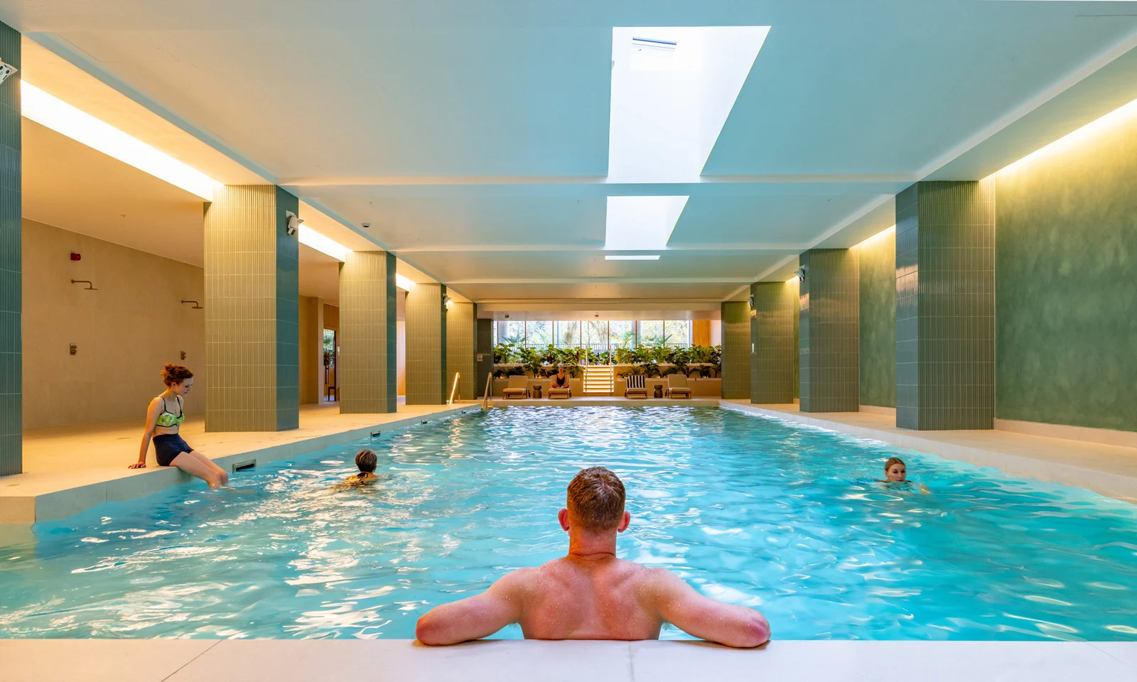 Residents swimming in the pool at The Maple Club