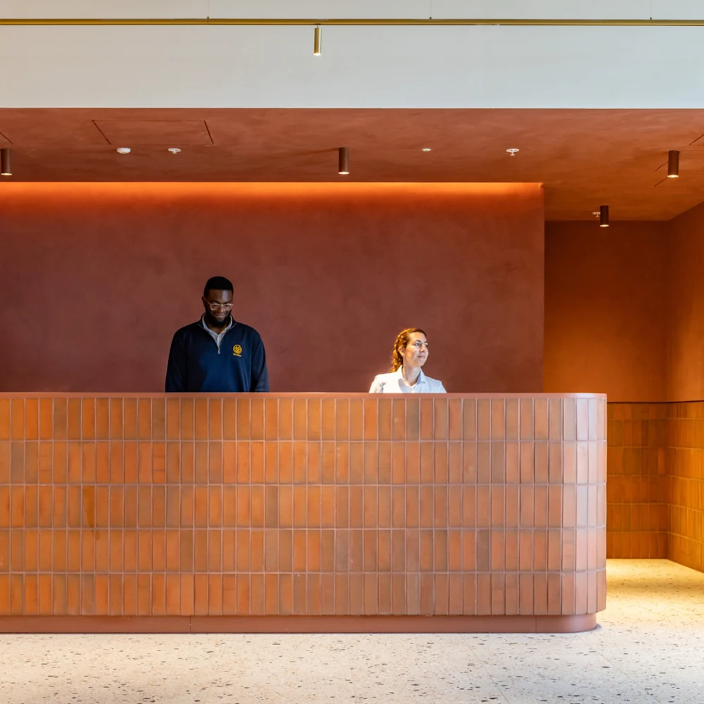The concierge team behind the front desk at The Maple