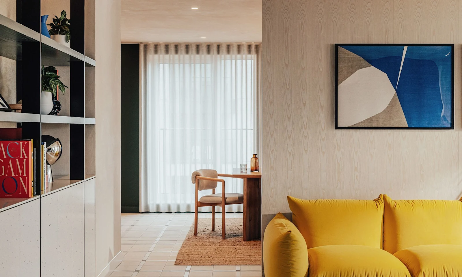 A resident lounge with a yellow sofa