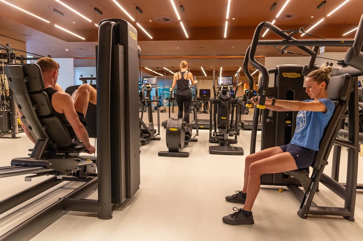 Residents working out in the gym at The Maple Club